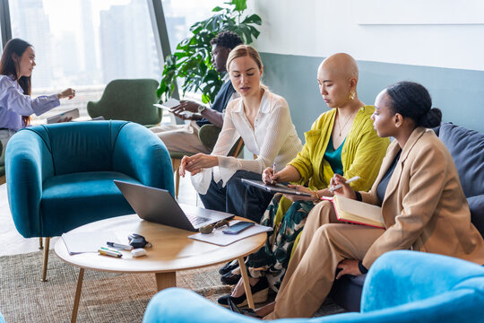 Women Working Together in a Modern Office Setting During the Day