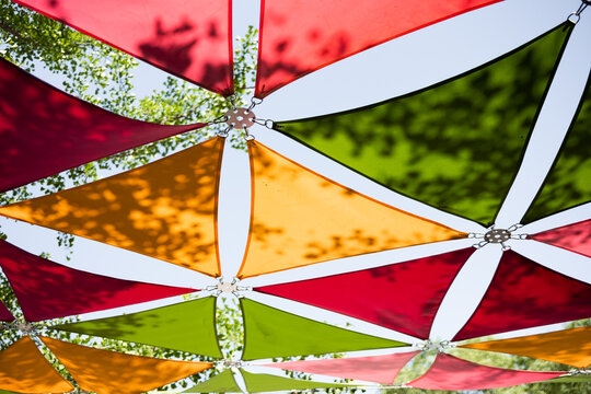 Colorful shades create patterns in a sunny park setting