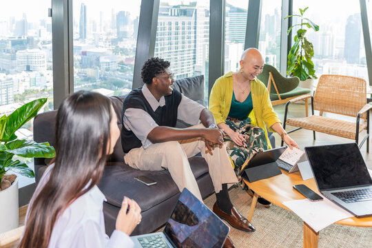 Group of People During a Meeting in a City Office Space
