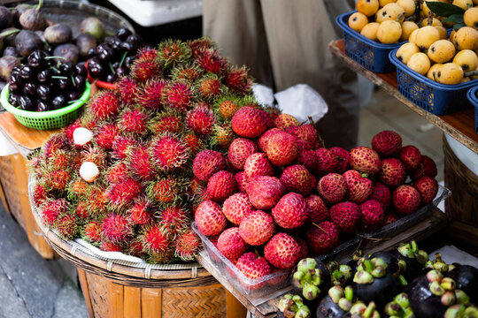 Fruit display at local market with various types of produce