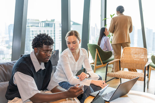 Team Members Work on Project in Modern Office Space