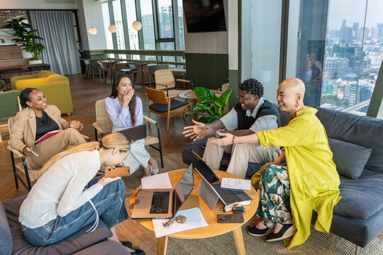 Group of People Meeting in Modern Office Space With City View