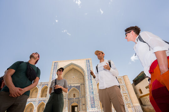 Tourists Listen to Guide in Bukhara, Uzbekistan