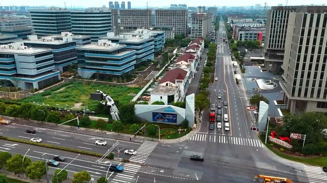 Forward Drone Flight Over Sijing Entrance and Urban Intersection