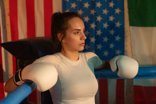 Female boxer before fight in USA gym. Woman Power