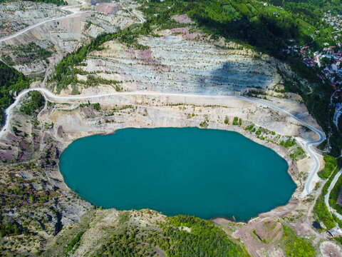 Turquoise water of lake. Aerial drone view of Lake Nula formed on a former mining site in Vares. Turquoise water of the flooded quarry lake in Vares Bosnia and Herzegovina.