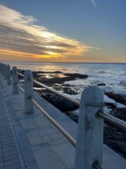 Sea Point Promenade overlooking rocky Atlantic coastline at sunset © Terra Lens