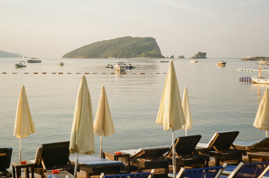 Relaxation at the Beach With Boats and Umbrellas in the Morning