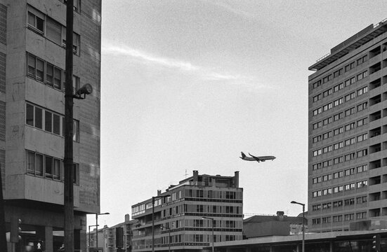 Airplane Between Buildings