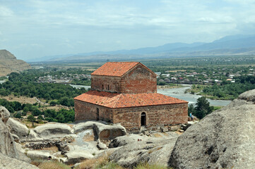 Uplistsikhe Church of the Prince situated among rock-cut caves overlooking the Mtkvari River valley in Georgia © MikhailT