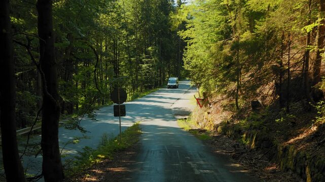 A car passing a bus on a mountain road