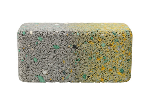 A rectangular block of recycled foam sponge material with colorful flecks and textures isolated on transparent background