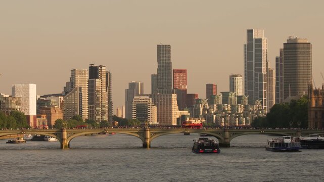 Stone bridge over the River Thames with modern riverside towers beyond