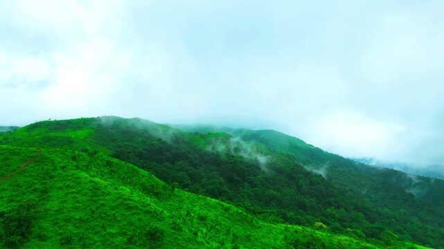 Kaginahare of Sakleshpur emerald mountains draped in clouds, a slice of Switzerland in Karnataka, india. Beautiful to watch this 4K video drone shot during monsoon Western Ghats, Sakleshpur, Karnataka