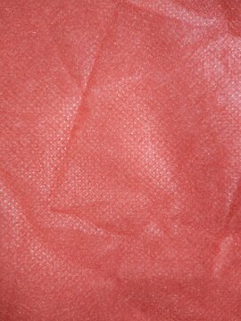 Red Non-Woven Fabric Texture Background Material with Wrinkles and Folds