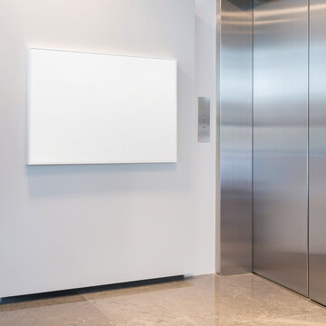 Empty elevator lobby with blank wall poster mockup