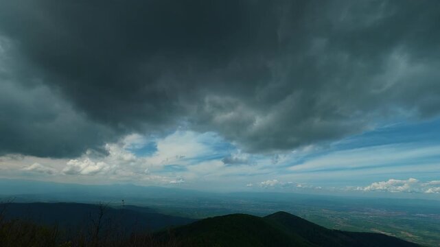 Dark clouds loom overhead, heavy and threatening. Jastrebac Mountain, Serbia.