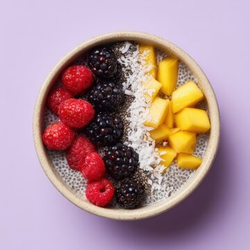 Glossy bowl with chia pudding berries coconut and mango arranged neatly, a colorful healthy breakfast image about clean eating nutrition and vibrant superfood recipes