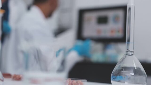 Scientist testing food samples in lab with microscope, vegetables, and meat for safety, nutrition, and biotechnology