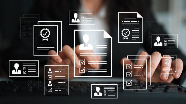 Professional resume building concept with digital elements, documents, checklists, and applicant profile graphics in a modern office workspace. Entropy.