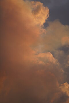 View of volcanic smoke and clouds illuminated by golden hour light at Fagradalsfjall Volcano, Grindavik, Grindavikurbaer, Iceland.
