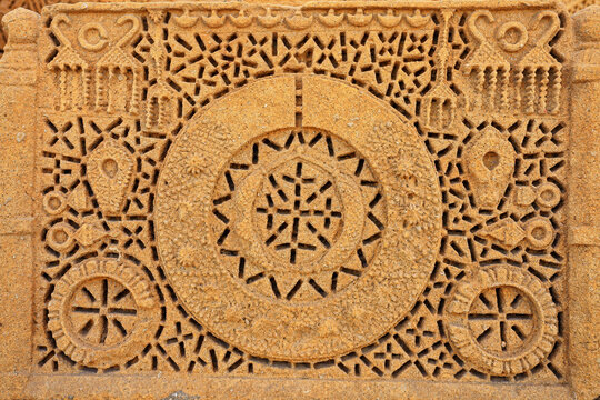 View of intricate stone carvings on the Chaukhandi tombs featuring geometric patterns and circular motifs in Karachi, Sindh, Pakistan.