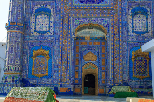 View of the intricate blue tile work and arched entrance of the Shrine of Sachal Sarmast in Daraza Sharif, Sindh, Pakistan.