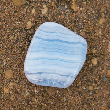 Blue Lace Agate Tumbled Stone on Natural Background