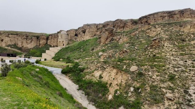 Diri Baba Tomb, located in Qobustan, Azerbaijan, is a mausoleum. It was built in 1402 for Sheikh Diri Baba.