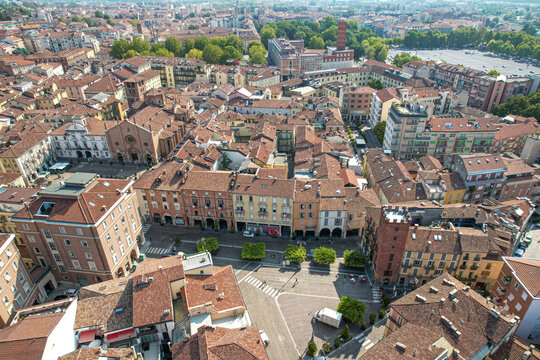 Aerial view of the historic center of Asti with its terracotta rooftops, medieval towers, and narrow streets in Asti, Piedmont, Italy.