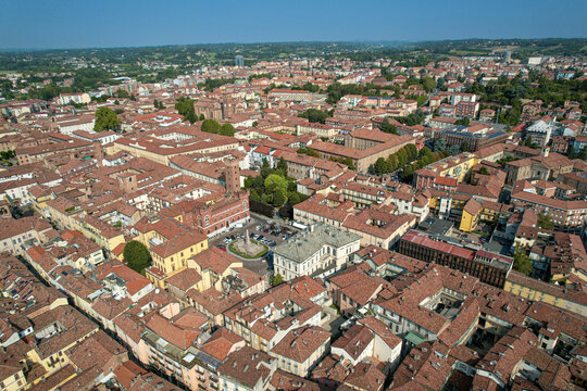 Aerial view of the historic city of Asti with its dense terracotta rooftops, medieval towers, and narrow streets in Asti, Piedmont, Italy.