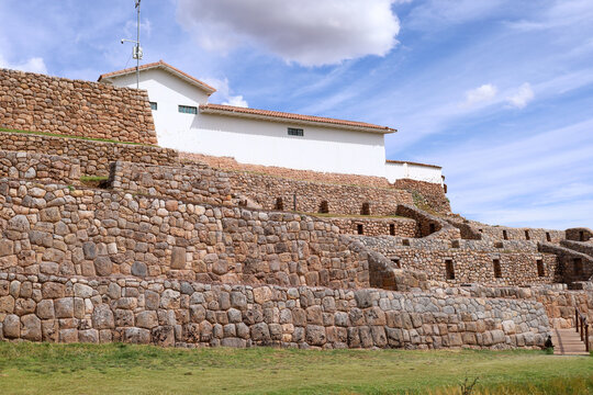 View of the historic Incan stone walls and colonial architecture at the Chinchero archaeological site in Cusco, Cusco, Peru.