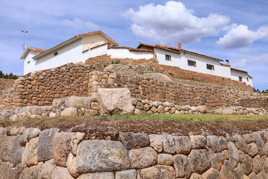 View of the ancient Inca stone walls and colonial architecture at the Chinchero archaeological site in Cusco, Cusco, Peru.