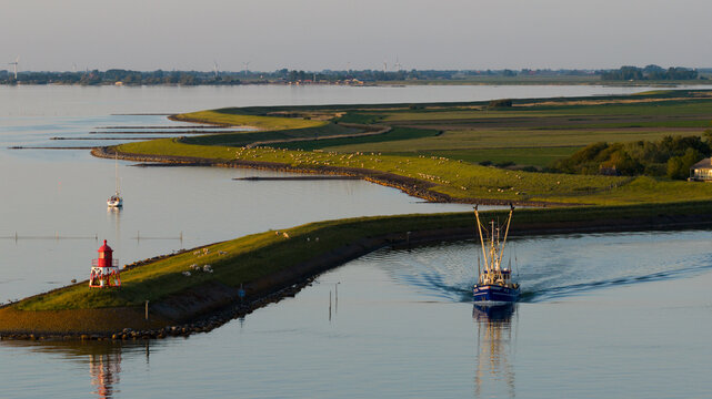 Aerial view of Dutch Shrimp Fishing Boat Leaving Stavoren at Sunset