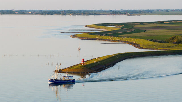 Aerial view of Dutch Shrimp Fishing Boat Leaving Stavoren at Sunset