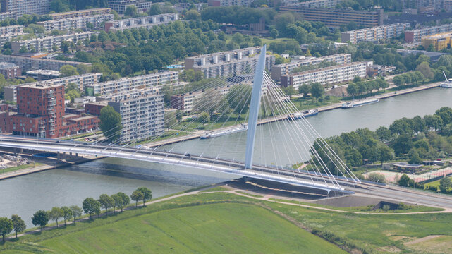 Aerial view of Prins Clausbrug, a modern cable-stayed bridge spanning the Amsterdam-Rhine Canal, surrounded by urban residential buildings in Utrecht, Utrecht, Netherlands.