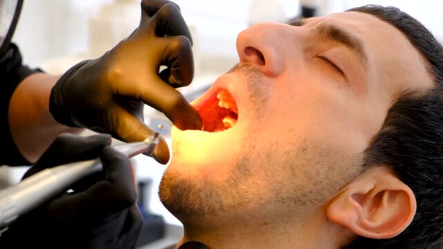 A man at a dentist appointment. Selective focus.