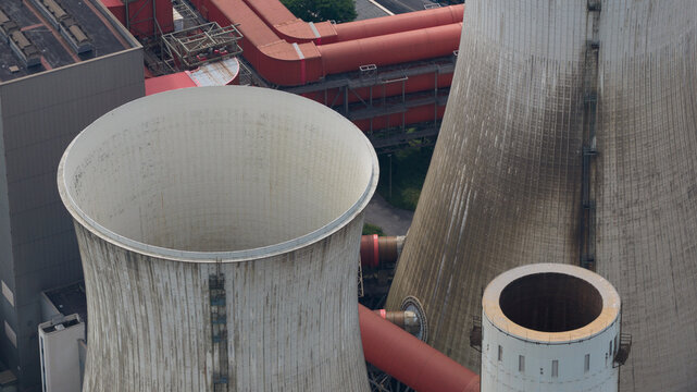 Aerial view of Kraftwerk Niederaussem showing large cooling towers and industrial infrastructure in Bergheim, Nordrhein-Westfalen, Germany.