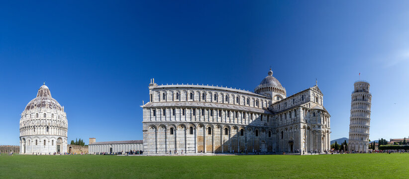 View of the Leaning Tower of Pisa, the Pisa Cathedral, and the Baptistery of St. John on the Piazza dei Miracoli in Pisa, Toscana, Italy.
