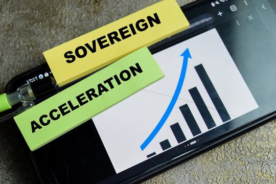 Concept of sovereign acceleration write on sticky notes isolated on Wooden Table. For strategic market growth