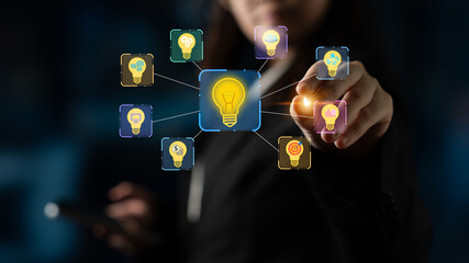 Businessperson Selecting Innovative Ideas from a Digital Interface with Light Bulb Icons Representing Creativity and Strategy. Entropy. © InfiniteFlow