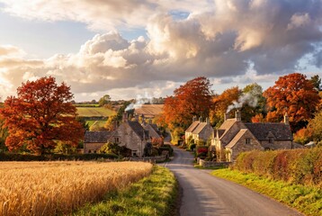 Fototapeta premium Cotswolds autumn village landscape with stone cottages and colorful trees