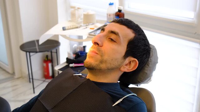A man at a dentist appointment. Selective focus.