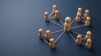 Obraz premium Central wooden figure with smiling face connected to groups of smaller figures through strings on dark blue background.