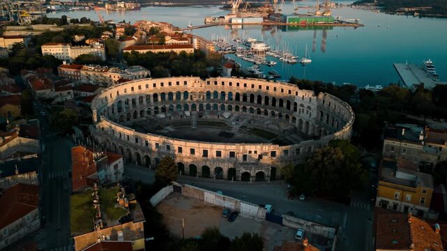 View of Pula Arena and historic city rooftops in Croatia.