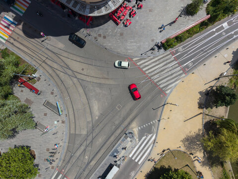 Brussels, Brussels, Belgium - 03 July 2026: Aerial view of the intersection at Flagey square featuring tram tracks, pedestrian crosswalks, and vehicles navigating the urban space.