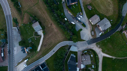 Obraz premium Aerial view of rural road, road junction in a mountain village