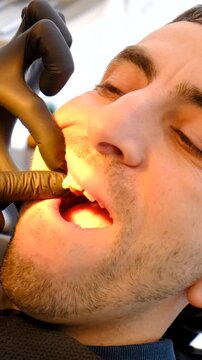 A man at a dentist appointment. Selective focus.