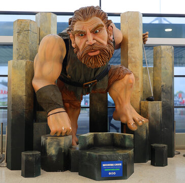 BELFAST NORTHERN IRELAND UNITED KINGDOM: The giant statue at Belfast Airport depicts Finn McCool and his "Wishing Chair" a wooden sculpture representing the famous giant from Irish mythologY
