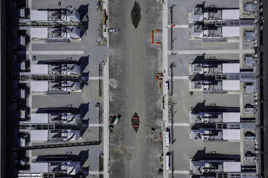 Aerial view of a large data center facility featuring rows of industrial cooling units and technical infrastructure on a gravel site, New Carlisle, Indiana, United States.